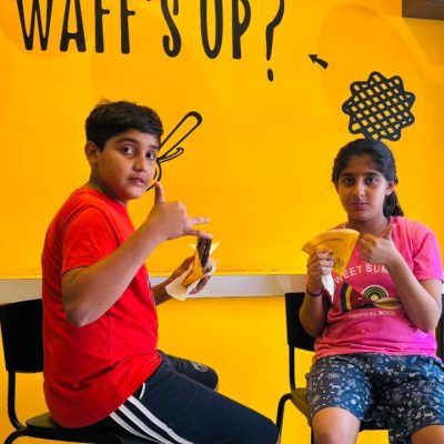 Two Kids inside the belgique bites co